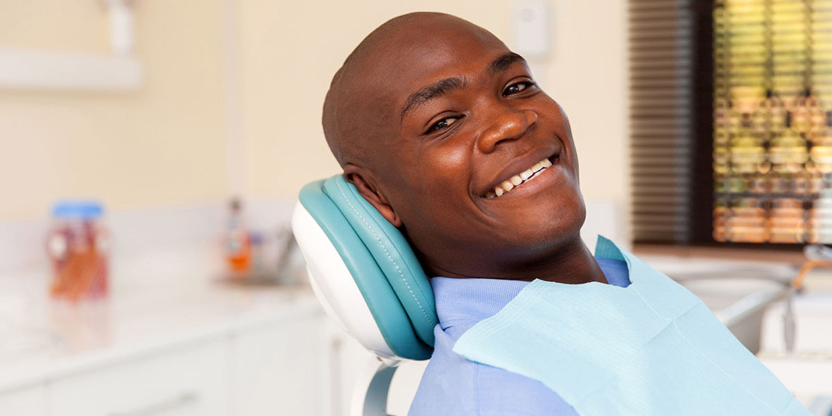 Smiling man in dental chair